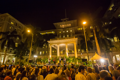 Image of a street event infront of a Waikīkī hotel. 