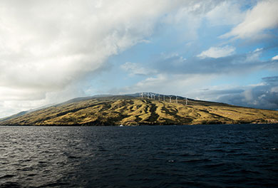 Image of a island from the viewpoint on the ocean. 